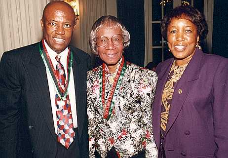 Shirley Chisholm (middle) posing with Congressman Edolphus Towns and his wife