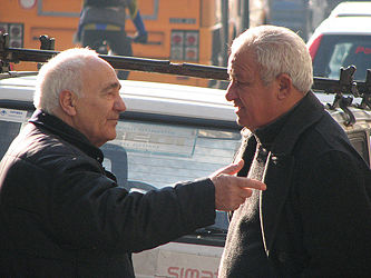 Humans instinctively communicate, as the conversation of these two men in Naples, Italy shows.
