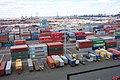 Port Elizabeth, NJ contains acres of shipping containers as well as a skyline of smokestacks from electrical generating stations.