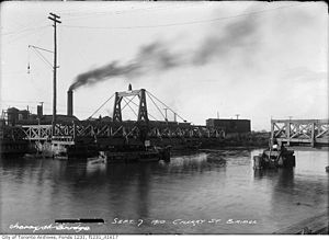 A wooden swing bridge over the Keating Channel in 1910.jpg