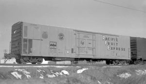 © Photo: Otto Perry / Denver Public Library A steel refrigerator car (Pacific Fruit Express #458330) sits on a siding at Denver, Colorado in March 1970. The mechanical refrigeration unit is housed at the car's "A" end, behind the grill at the lower right.